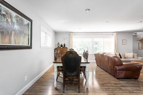 a living room with a table and a couch at 4Bedroom 2 Bath Home in Arts District-Smoky Row A in Carmel
