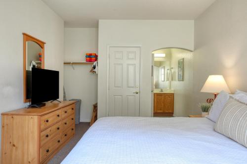 a bedroom with a bed and a television on a dresser at Pacific Plaza #504 - Heart of Oceano - 1BdrmD-King in Oceano