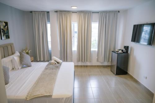 Ένα ή περισσότερα κρεβάτια σε δωμάτιο στο Davé Paradise