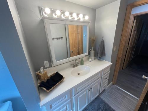 a bathroom with a sink and a mirror at The Cowboy Corral in Casper