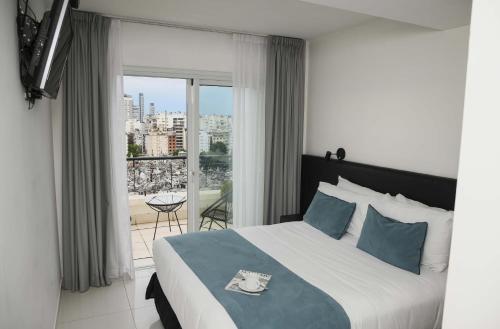 Ένα ή περισσότερα κρεβάτια σε δωμάτιο στο Cyan Recoleta Hotel