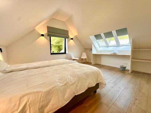 Giường trong phòng chung tại Ferme Valentour