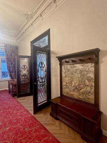 a room with three pieces of art on the wall at Hotel Rudolf II Karlovy Vary in Karlovy Vary