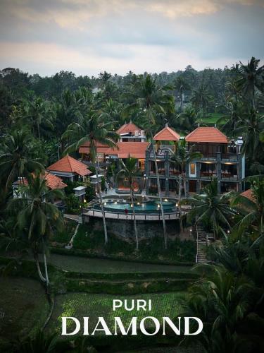an aerial view of a resort with a swimming pool at Puri Diamond Villas in Tampaksiring