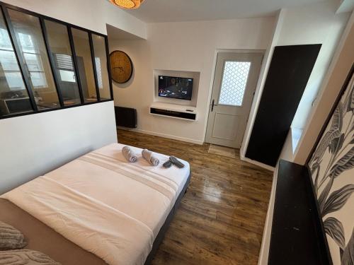 Cama o camas de una habitación en A l'angle du vieux marché