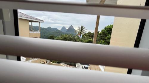 a view of the mountains from a window at Tranquil Villas in Soufrière