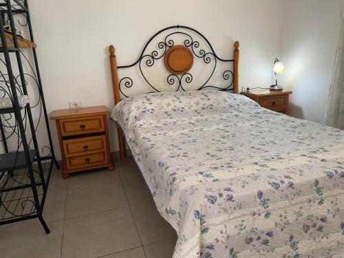 a bedroom with a bed and two night stands at Apartamento Callao Salvaje in Callao Salvaje