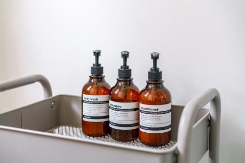 three bottles of sauce in a rack in a refrigerator at Short North Convention Private Parking Pets! in Columbus