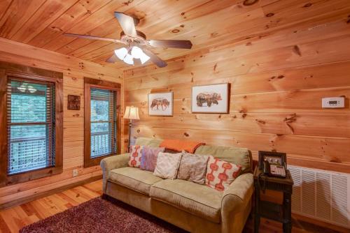 a living room with a couch and a ceiling fan at 1 Awesome Skyview in Vilas