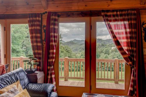 a living room with a couch and two windows at 1 Awesome Skyview in Vilas