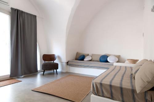 Postelja oz. postelje v sobi nastanitve Masseria San Martino
