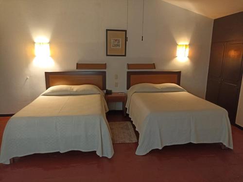 Postel nebo postele na pokoji v ubytování Hotel Ilebal Cuernavaca Centro - lugar con encanto!