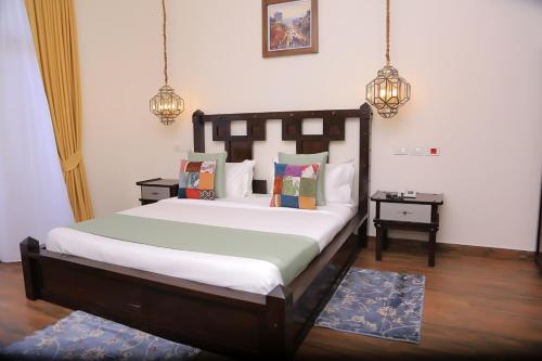 a bedroom with a large bed in a room at Pyramid Hotels & Resorts in Debre Zeyit