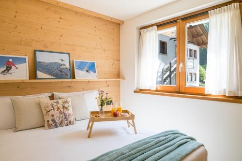 Ένα ή περισσότερα κρεβάτια σε δωμάτιο στο Casa Ludis Bormio