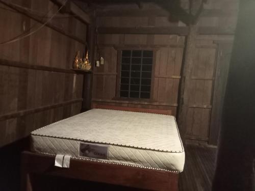a mattress sitting on a table in a room at Sconvolts Homestay in Kratie