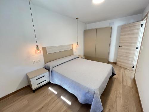 a bedroom with a large bed in a room at Casa Collado Apartmento 2A in San Vicente