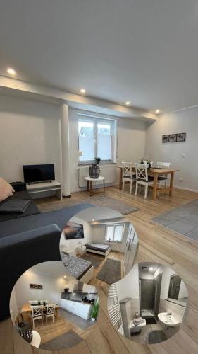 a living room with a couch and a table at Ferienwohnung in Kaunitz bei Wessels in Verl