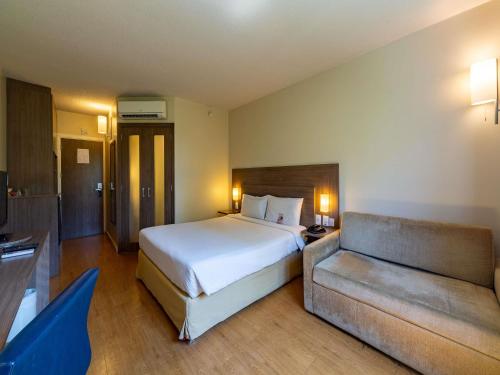 Postel nebo postele na pokoji v ubytování Novotel Manaus