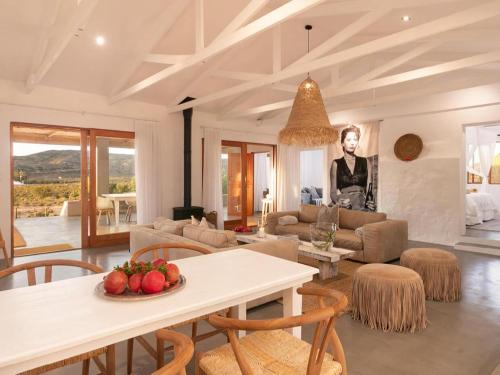 a living room with a table with fruit on it at Aardvark Bioreserve in Ladismith