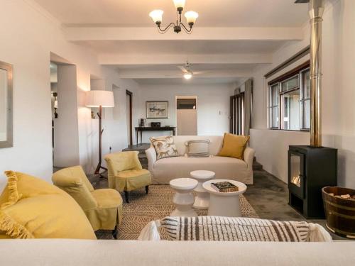 a living room with a couch and a table at Aardvark Bioreserve in Ladismith