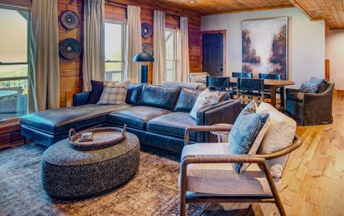 a living room with a couch and a table at Owls Nest in Seven Devils
