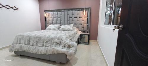 Hotel y Cabañas Parinzziにあるベッド