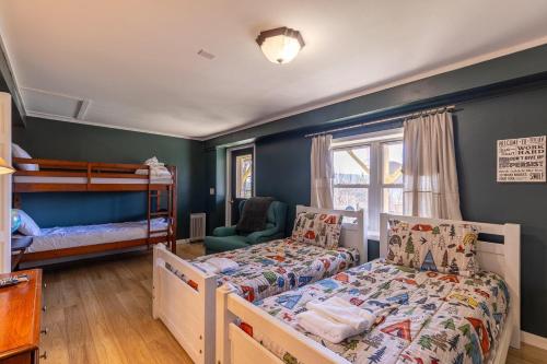 a bedroom with two bunk beds and a crib at Grandview Getaway in Boone