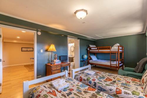 a bedroom with two bunk beds and a living room at Grandview Getaway in Boone