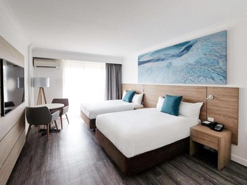 Postel nebo postele na pokoji v ubytování Novotel Cairns Oasis Resort