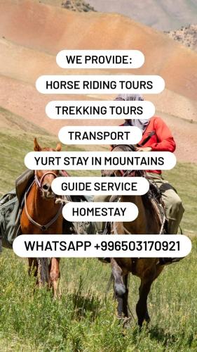 a person riding a horse in a field at Travel Around Guest House in Kochkor