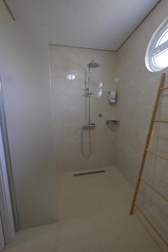 a bathroom with a shower with a glass door at Quinta da Bouça - Casa do Canastro in Vale de Cambra