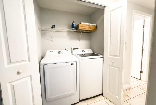 a white washer and dryer in a small room at Chic & Stylish House In Tampa Ybor&busch in Tampa