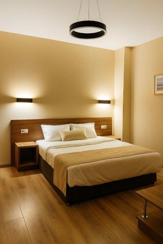 a bedroom with a large bed in a room at Bakuriani Crystal resort 408 in Bakuriani