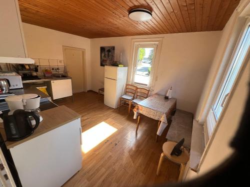 an overhead view of a kitchen and dining room at Siegen Achenbach 3 in Siegen