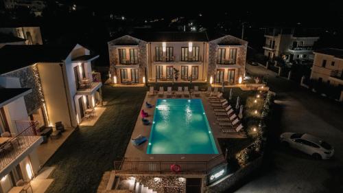 an aerial view of a house with a swimming pool at Helios Sivota in Sivota