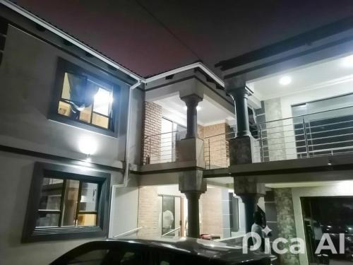 a house with a car parked in front of it at Nelspruit Nice luxury lodge in Nelspruit