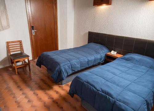 En eller flere senge i et værelse på Hotel Central Teziutlan