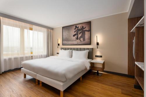 Un ou plusieurs lits dans un hébergement de l'établissement Radisson Blu Hotel & Spa, Daugava Riga