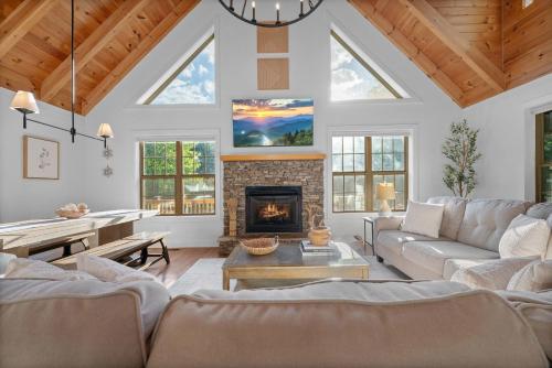 a living room with a couch and a fireplace at Vista View in Sugar Grove