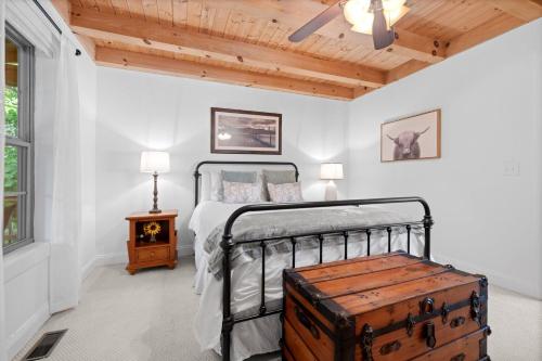 a bedroom with a bed with a wooden ceiling at Vista View in Sugar Grove
