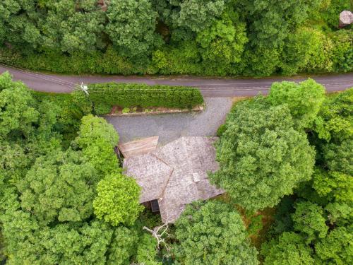 an aerial view of a building in the middle of a forest at On Any Sunday in Blowing Rock