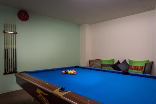 a room with a pool table with balls on it at Shianghu Boutique Hotel in Chiayi City