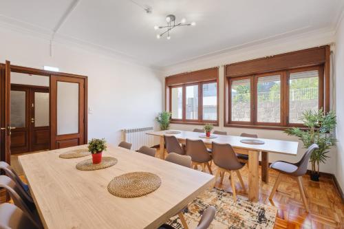 a large room with a table and chairs at Villa 7BR & 7BA with Pool & Backyard in a Prime Location! in Vila Nova de Gaia