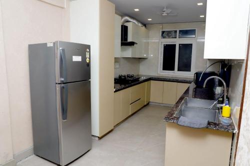 Una cocina o cocineta en Stella Homestay- Near Yashobhoomi