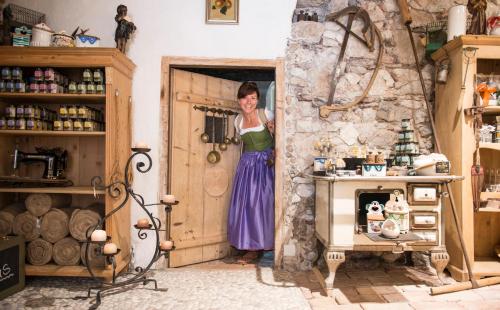 a woman standing in a door in a room at Salzhaus in Hallstatt