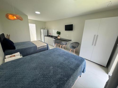 Ένα ή περισσότερα κρεβάτια σε δωμάτιο στο Studio Top no Residencial Porto Mar