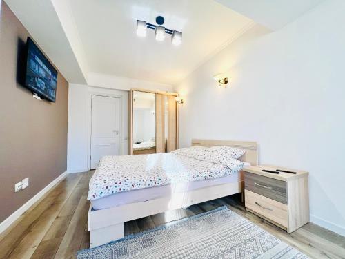 Llit o llits en una habitació de Avenue Apartment