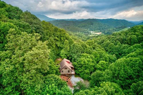 an aerial view of a house in the middle of a forest at The Guf in Sugar Grove