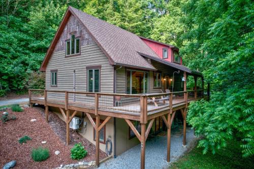 a large wooden house with a large deck at The Guf in Sugar Grove