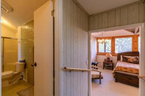 a bedroom with a bed and a bathroom at Endless Vistas in Seven Devils